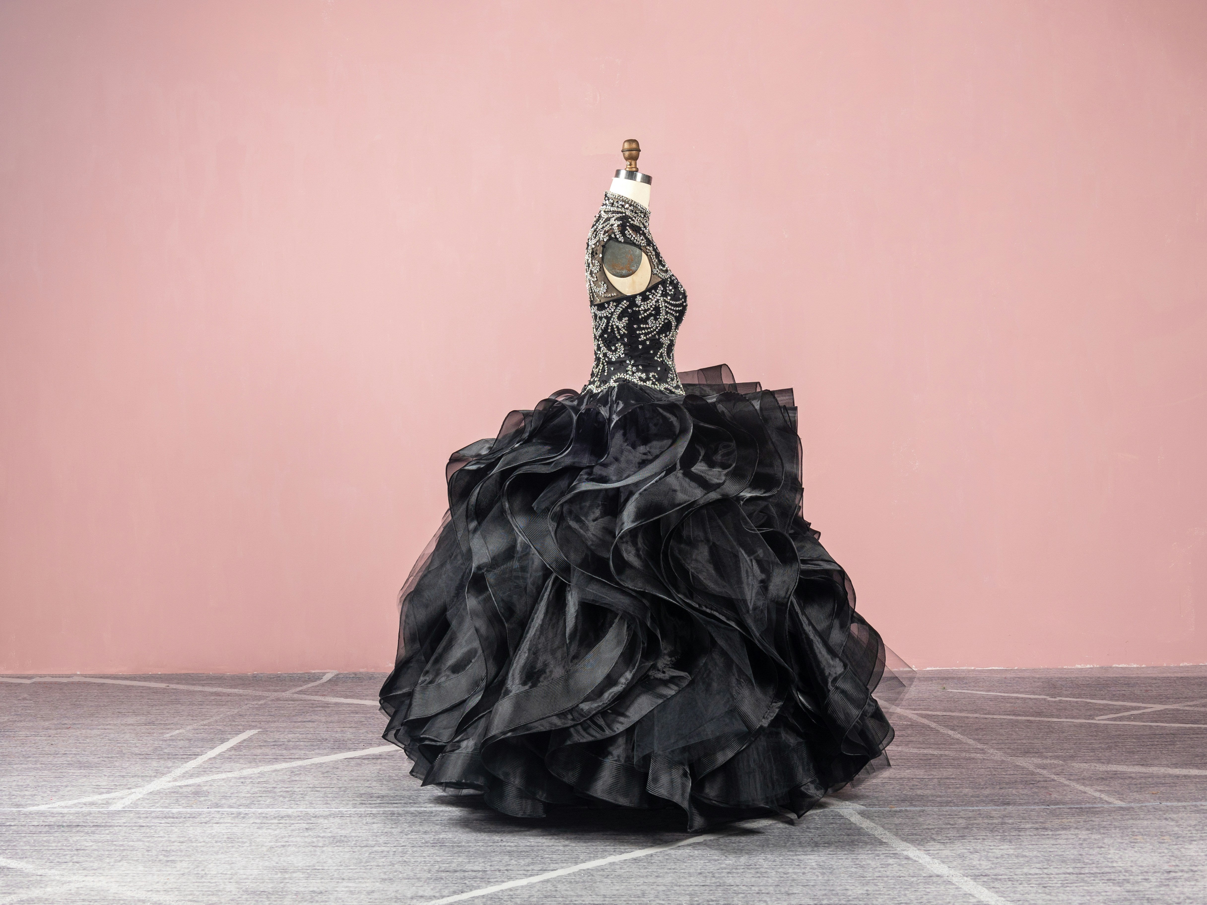 Dramatic black ball gown with a heavily beaded corset bodice and a voluminous ruffled skirt, luxury eveningwear inspiration by Sewn In The Wood.