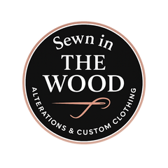 Official brand logo for Sewn In The Wood luxury custom couture and formalwear.